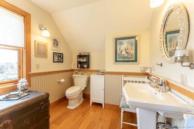 49 Bayberry Ln, Groton, CT 06340 - bathroom featuring wood finished floors, vaulted ceiling, and wainscoting
