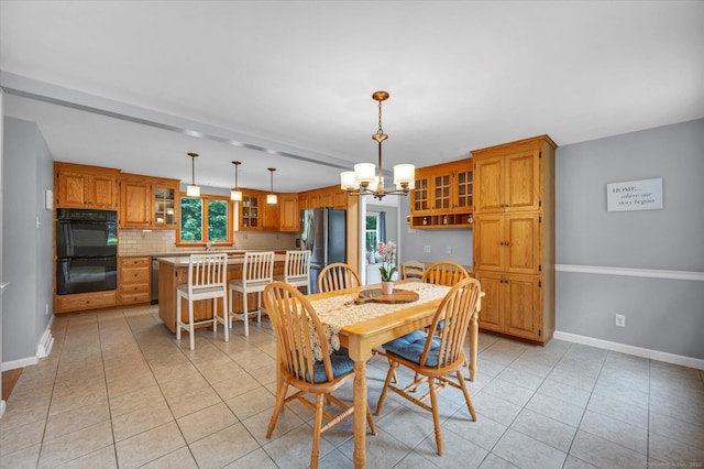 7 Beechwood Cir, Cromwell, CT 06416 - dining area featuring a chandelier, light tile patterned floors, and baseboards