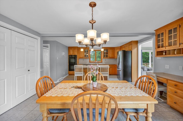 7 Beechwood Cir, Cromwell, CT 06416 - dining room featuring a chandelier, light tile patterned flooring, a desk, and baseboards