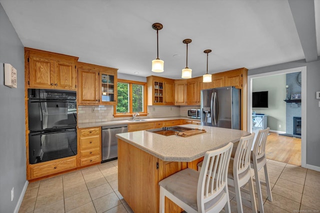 7 Beechwood Cir, Cromwell, CT 06416 - kitchen with stainless steel appliances, a sink, baseboards, and backsplash