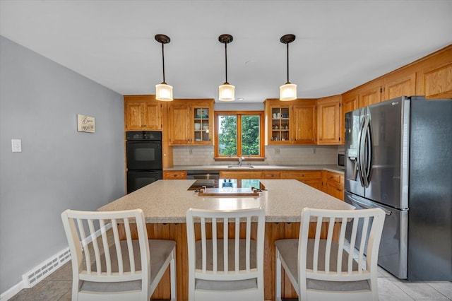 7 Beechwood Cir, Cromwell, CT 06416 - kitchen with stainless steel appliances, a sink, backsplash, and light countertops