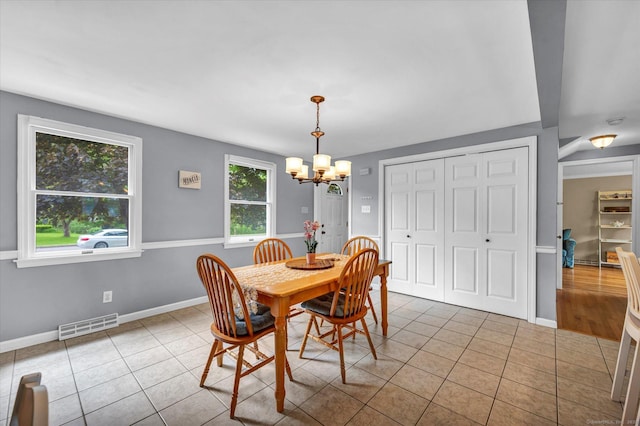 7 Beechwood Cir, Cromwell, CT 06416 - tiled dining space with a chandelier and baseboards