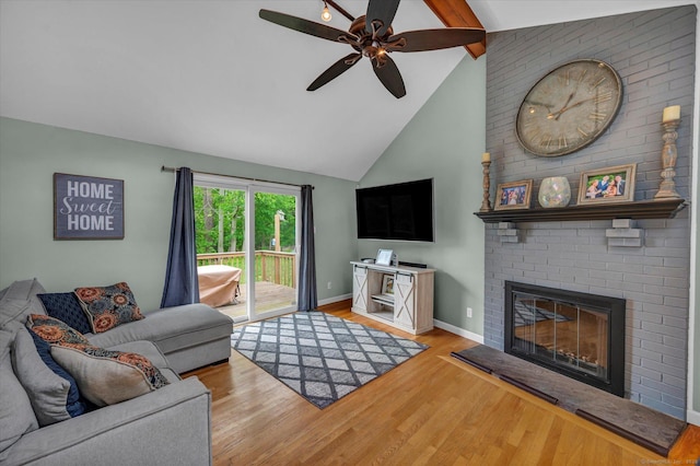 7 Beechwood Cir, Cromwell, CT 06416 - living room with a ceiling fan, a brick fireplace, baseboards, wood finished floors, and beamed ceiling