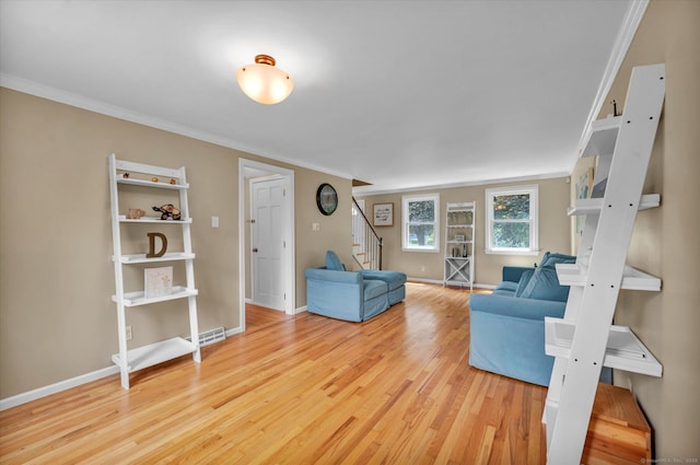 7 Beechwood Cir, Cromwell, CT 06416 - living room with stairs, wood finished floors, crown molding, and baseboards