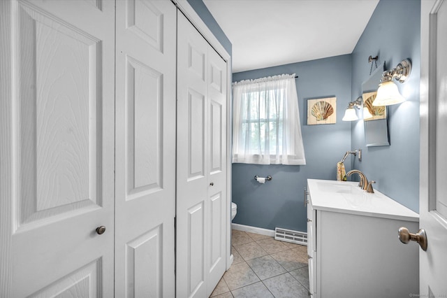 7 Beechwood Cir, Cromwell, CT 06416 - bathroom featuring toilet, vanity, tile patterned floors, and a closet