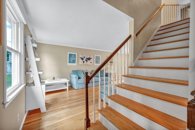 7 Beechwood Cir, Cromwell, CT 06416 - stairs with plenty of natural light, wood finished floors, baseboards, and crown molding