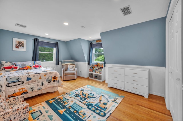 7 Beechwood Cir, Cromwell, CT 06416 - bedroom featuring multiple windows, light wood finished floors, a wainscoted wall, a closet, and recessed lighting