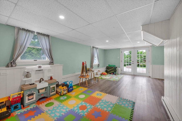 7 Beechwood Cir, Cromwell, CT 06416 - game room with a paneled ceiling, french doors, wainscoting, wood finished floors, and baseboard heating