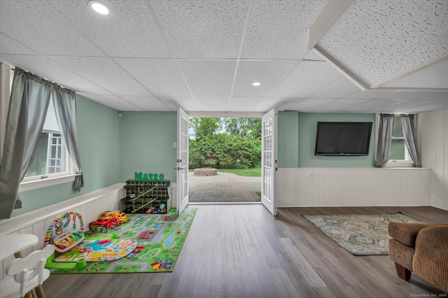 7 Beechwood Cir, Cromwell, CT 06416 - game room featuring a wainscoted wall, plenty of natural light, a paneled ceiling, and wood finished floors