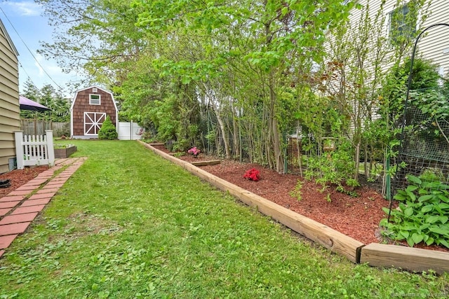 view of yard with an outbuilding and a barn