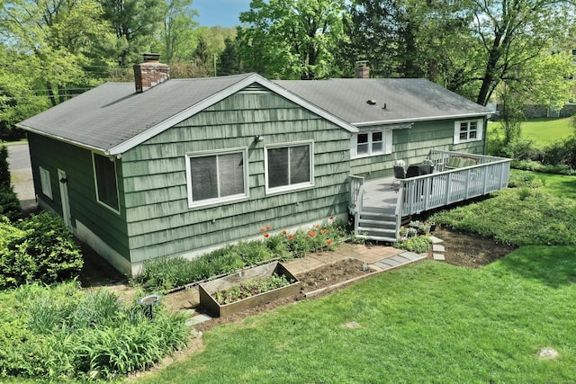 12 Cedar Ln, Oxford, CT 06478 - rear view of property featuring a chimney, a deck, and a lawn