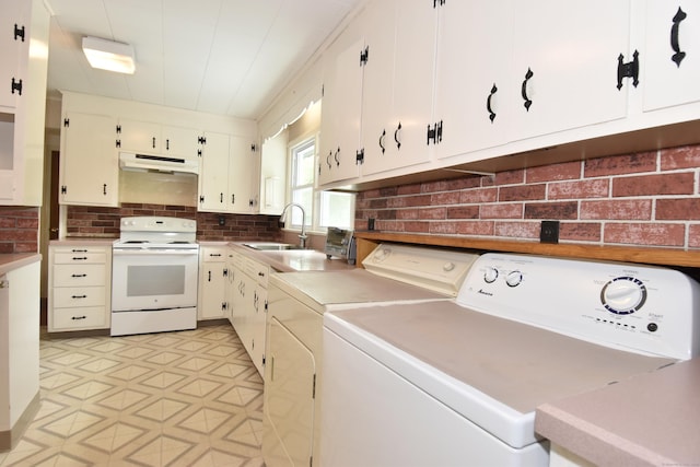 12 Cedar Ln, Oxford, CT 06478 - kitchen featuring white range with electric stovetop, a sink, under cabinet range hood, washing machine and dryer, and light flooring