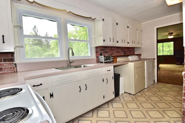 12 Cedar Ln, Oxford, CT 06478 - kitchen with a sink, white cabinets, white electric stove, light countertops, and ornamental molding