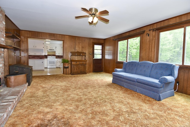 12 Cedar Ln, Oxford, CT 06478 - carpeted living area with wood walls and a ceiling fan
