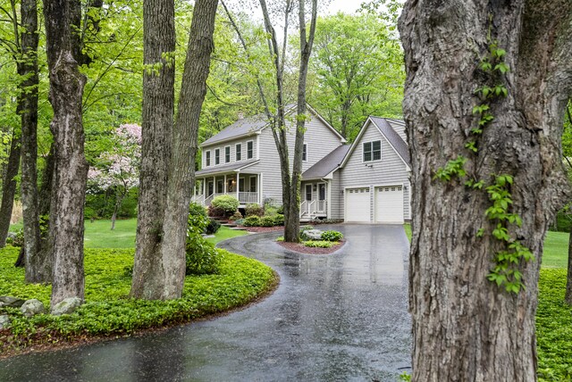 79 Erdoni Rd, Columbia, CT 06237 - view of front of home featuring asphalt driveway and covered porch