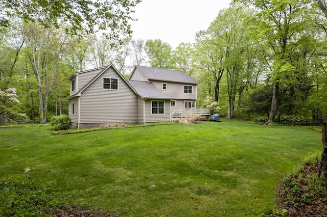 79 Erdoni Rd, Columbia, CT 06237 - back of house featuring a lawn and a wooden deck
