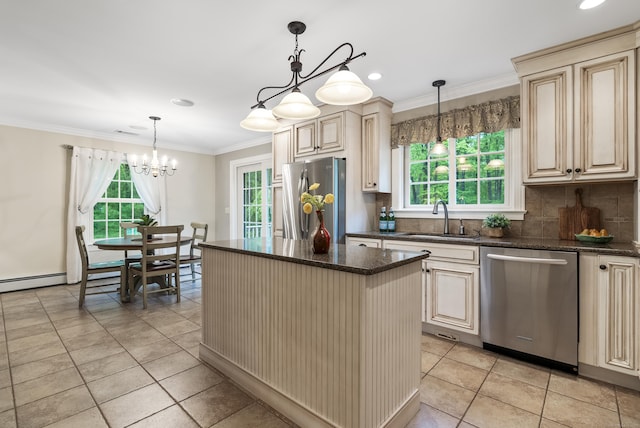 79 Erdoni Rd, Columbia, CT 06237 - kitchen featuring appliances with stainless steel finishes, cream cabinetry, a sink, plenty of natural light, and ornamental molding