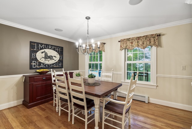 79 Erdoni Rd, Columbia, CT 06237 - dining room with a chandelier, ornamental molding, wood finished floors, a baseboard radiator, and baseboards