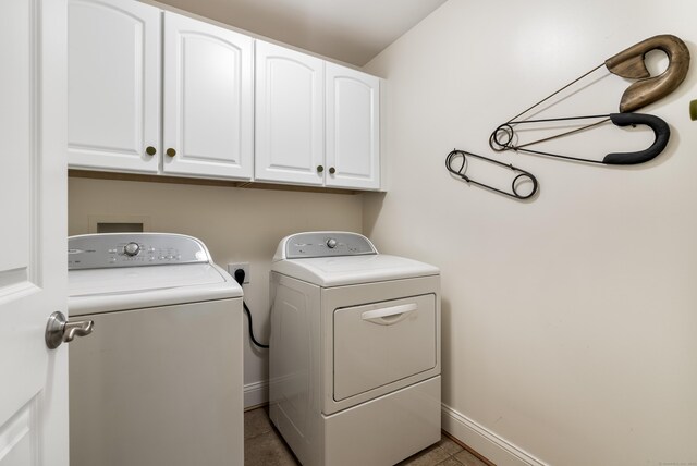 79 Erdoni Rd, Columbia, CT 06237 - laundry room with cabinet space, washer and clothes dryer, baseboards, and tile patterned floors