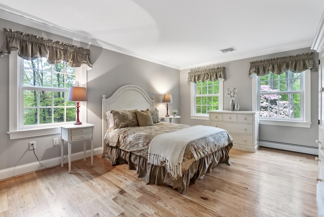 79 Erdoni Rd, Columbia, CT 06237 - bedroom with a baseboard heating unit, ornamental molding, light wood finished floors, and baseboards
