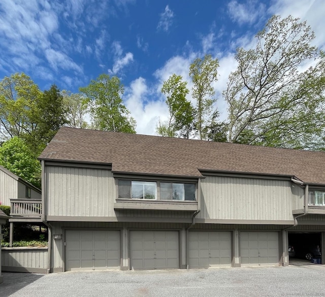 view of property with a shingled roof