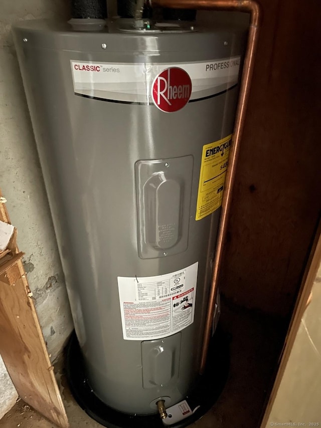 utility room featuring electric water heater