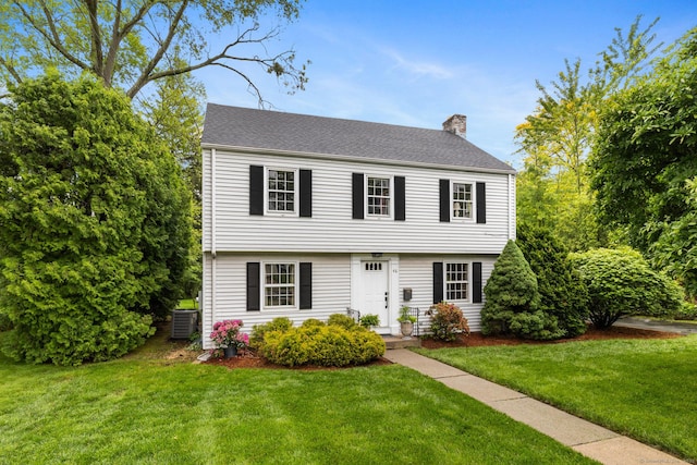 46 Glenbrook Rd, West Hartford, CT 06107 - colonial house featuring a chimney, a front lawn, and central AC