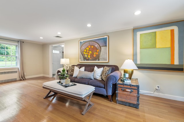 46 Glenbrook Rd, West Hartford, CT 06107 - living room featuring radiator, crown molding, baseboards, wood finished floors, and recessed lighting