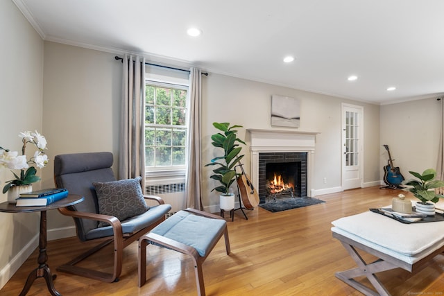 46 Glenbrook Rd, West Hartford, CT 06107 - living area with radiator heating unit, ornamental molding, recessed lighting, a fireplace, and baseboards