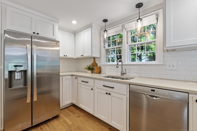 46 Glenbrook Rd, West Hartford, CT 06107 - kitchen with stainless steel appliances, a sink, white cabinetry, light countertops, and recessed lighting