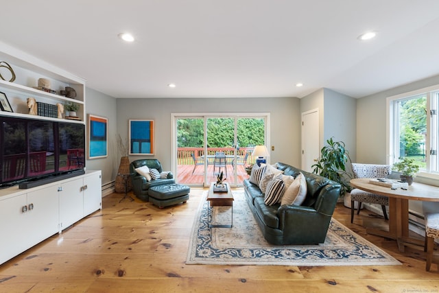 46 Glenbrook Rd, West Hartford, CT 06107 - living room with plenty of natural light, recessed lighting, light wood-style floors, and a baseboard heating unit