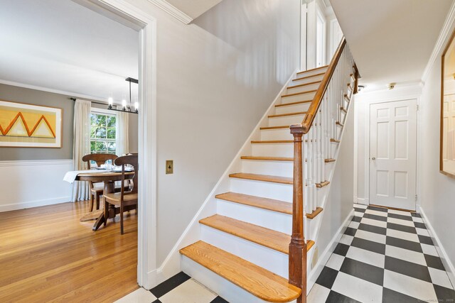 46 Glenbrook Rd, West Hartford, CT 06107 - staircase featuring a chandelier, crown molding, tile patterned floors, and baseboards