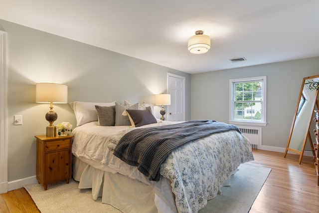 46 Glenbrook Rd, West Hartford, CT 06107 - bedroom with radiator, baseboards, and light wood-type flooring