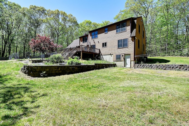 7 Stonegate Rd, East Hampton, CT 06424 - rear view of house with a lawn, a wooden deck, and stairs