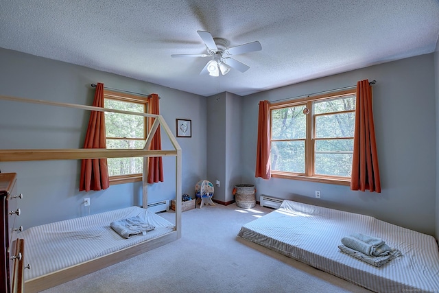 7 Stonegate Rd, East Hampton, CT 06424 - bedroom featuring baseboard heating, carpet flooring, a textured ceiling, and ceiling fan