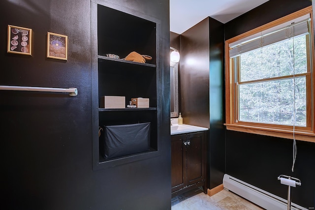 7 Stonegate Rd, East Hampton, CT 06424 - bathroom with baseboard heating, vanity, and baseboards