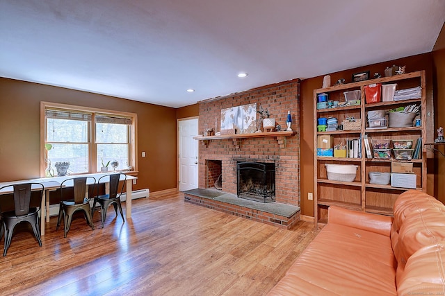 7 Stonegate Rd, East Hampton, CT 06424 - living area with a brick fireplace, wood finished floors, recessed lighting, and baseboards
