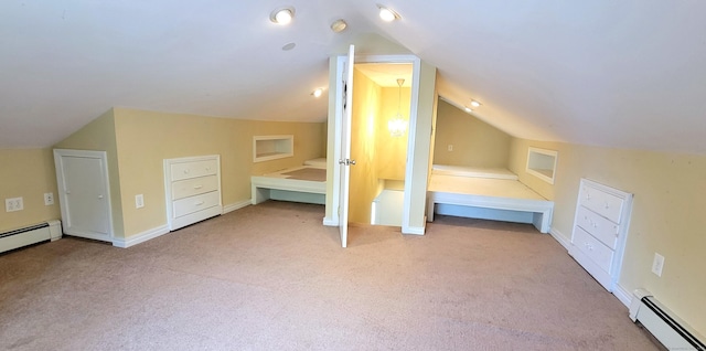 bonus room with a baseboard heating unit, lofted ceiling, and carpet