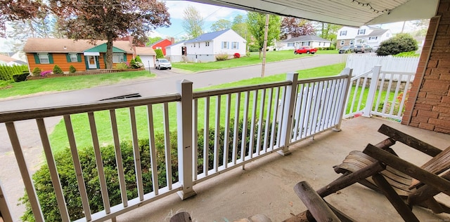 balcony featuring a residential view and covered porch