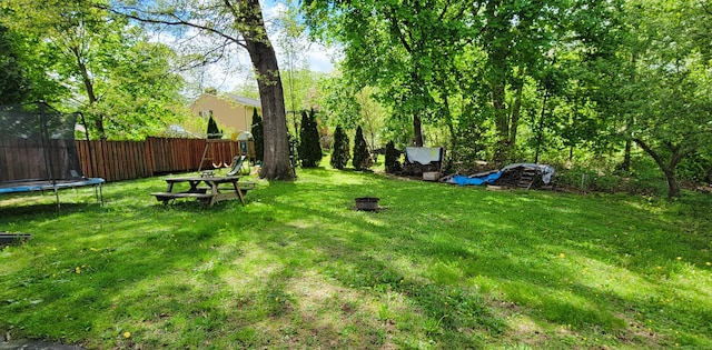 view of yard with a trampoline