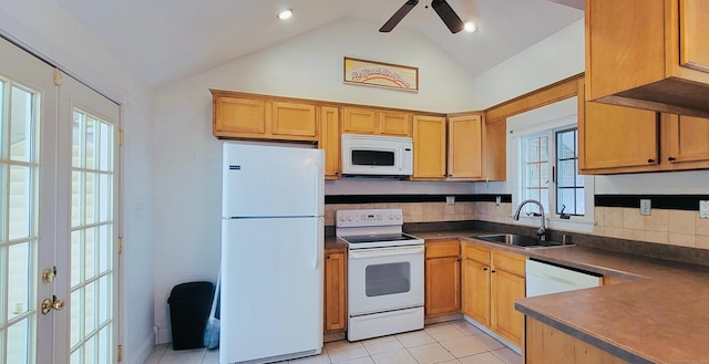 kitchen with white appliances, a sink, dark countertops, tasteful backsplash, and high vaulted ceiling