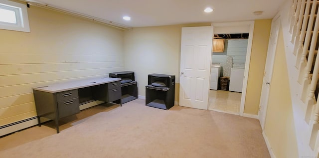 unfurnished office featuring recessed lighting, light colored carpet, washing machine and clothes dryer, and a baseboard heating unit
