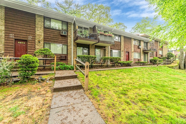 173 Kennedy Dr Unit 173, Bridgeport, CT 06606 - view of front facade with a front lawn and brick siding