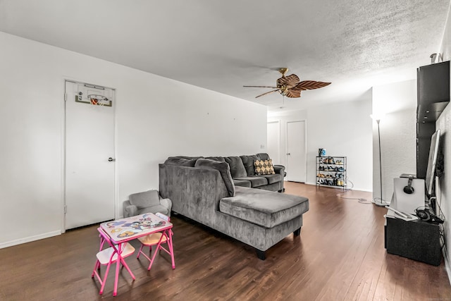 173 Kennedy Dr Unit 173, Bridgeport, CT 06606 - living area with dark wood-style flooring, ceiling fan, and baseboards