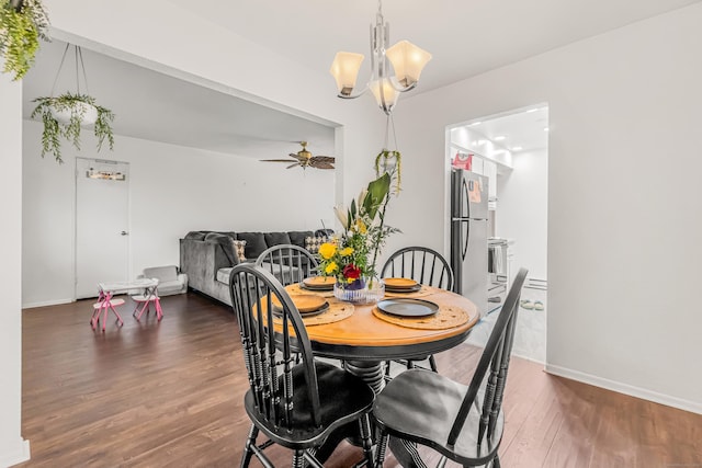 173 Kennedy Dr Unit 173, Bridgeport, CT 06606 - dining space featuring a chandelier, wood finished floors, baseboards, and a ceiling fan