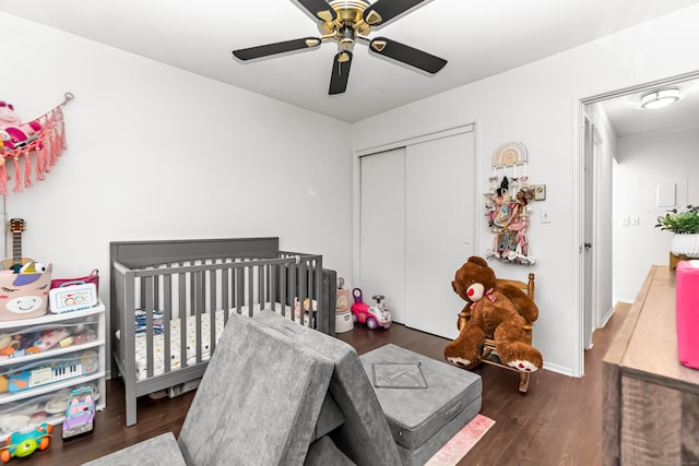 173 Kennedy Dr Unit 173, Bridgeport, CT 06606 - bedroom featuring a closet, wood finished floors, a ceiling fan, a nursery area, and baseboards