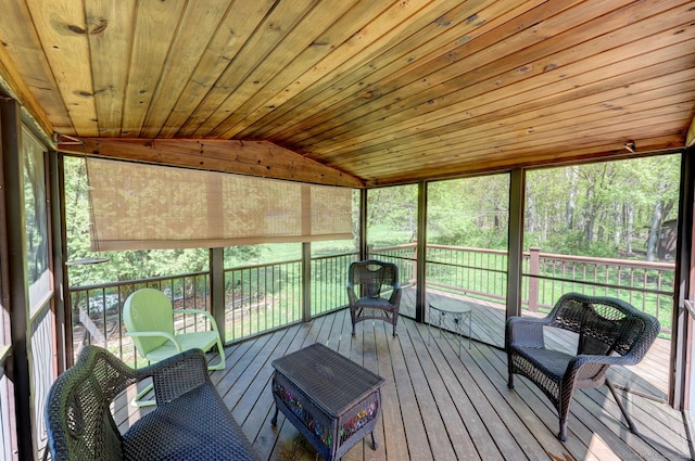 sunroom with lofted ceiling and healthy amount of natural light