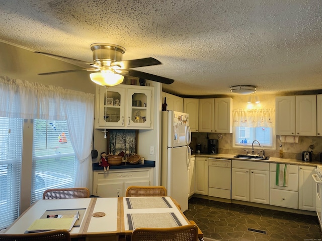 91 Shawnee Rd, East Hartford, CT 06118 - kitchen featuring a sink, white appliances, white cabinetry, and a textured ceiling