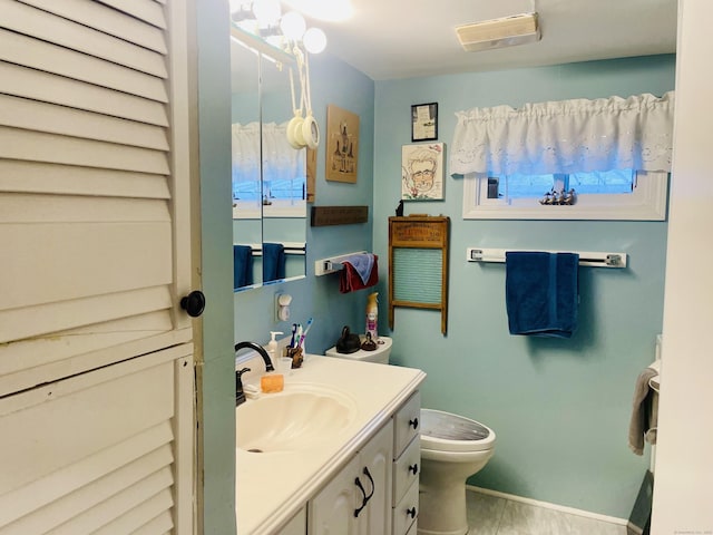 91 Shawnee Rd, East Hartford, CT 06118 - bathroom with toilet, vanity, and tile patterned flooring
