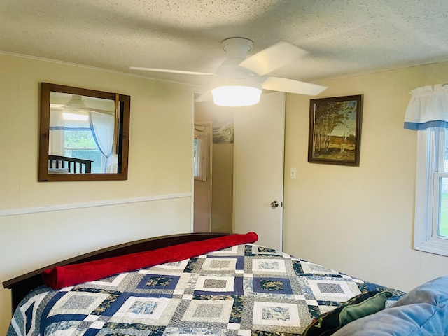 91 Shawnee Rd, East Hartford, CT 06118 - bedroom with a textured ceiling, a ceiling fan, and crown molding